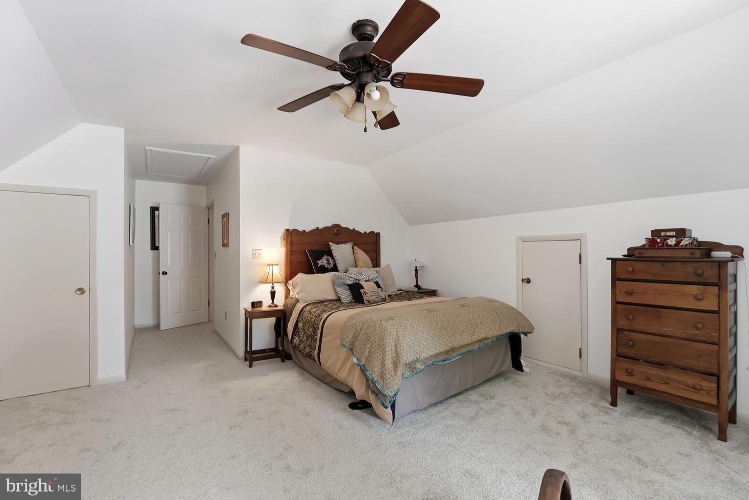 814 Wrights Neck Road Centreville, MD 21617 - Photo 46 of 53 a bed room with a bed and a ceiling fan