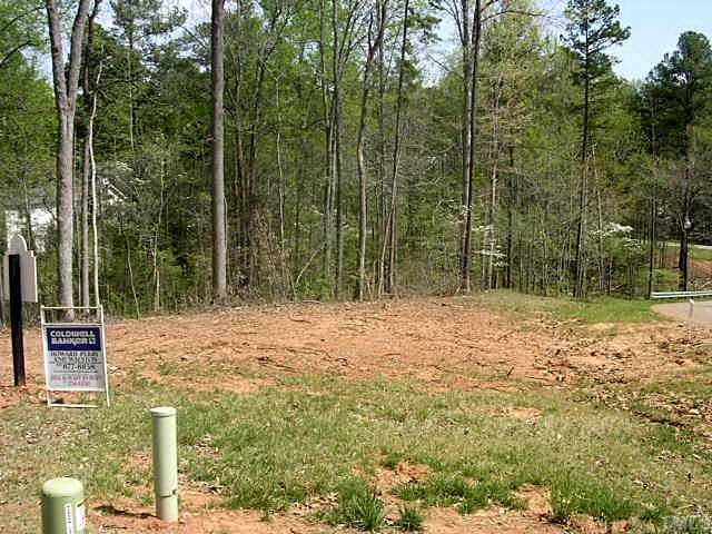 2408 Loring Court, Unit 7 Raleigh, NC 27613 - Photo 4 of 10 a backyard of a house with large trees