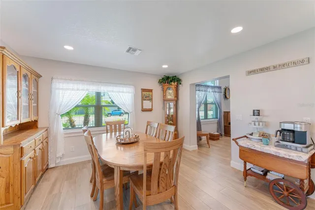 a large kitchen with stainless steel appliances lots of counter space and a sink