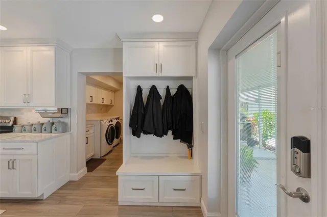 a spacious bathroom with double vanity and mirrors