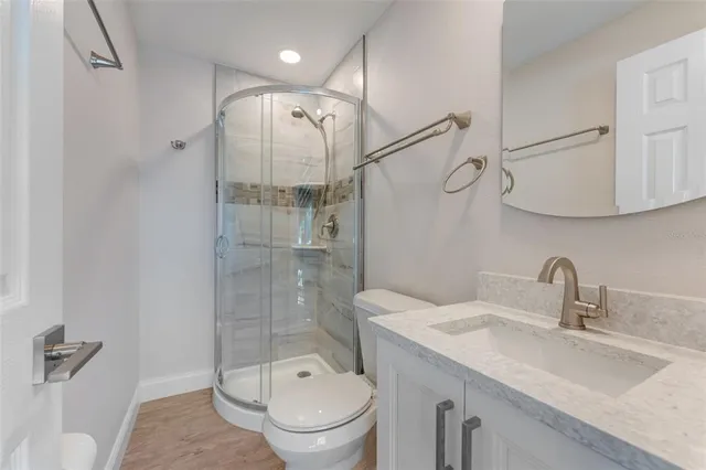 a living room with furniture and potted plant