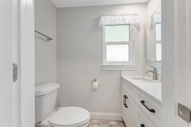 a bed room with a bed and a night stand