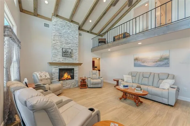 a view of a livingroom with furniture and a window
