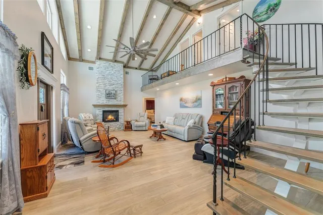 a living room with furniture and fireplace