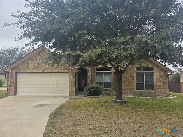 front view of a house with a dry yard