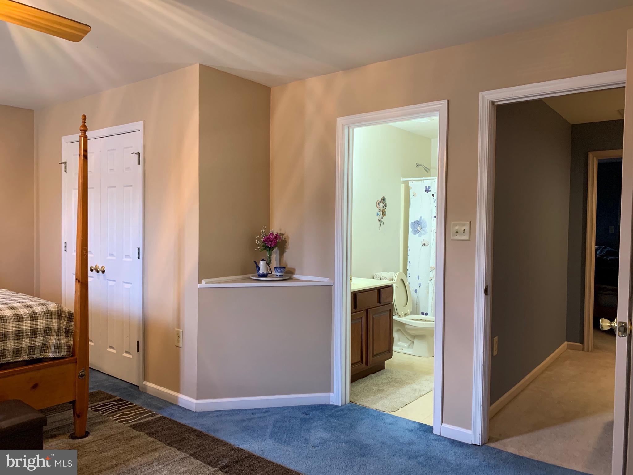 78 Baltusrol Drive Charles Town, WV 25414 - Photo 6 of 26 a view of a hallway with bathroom and wooden floor