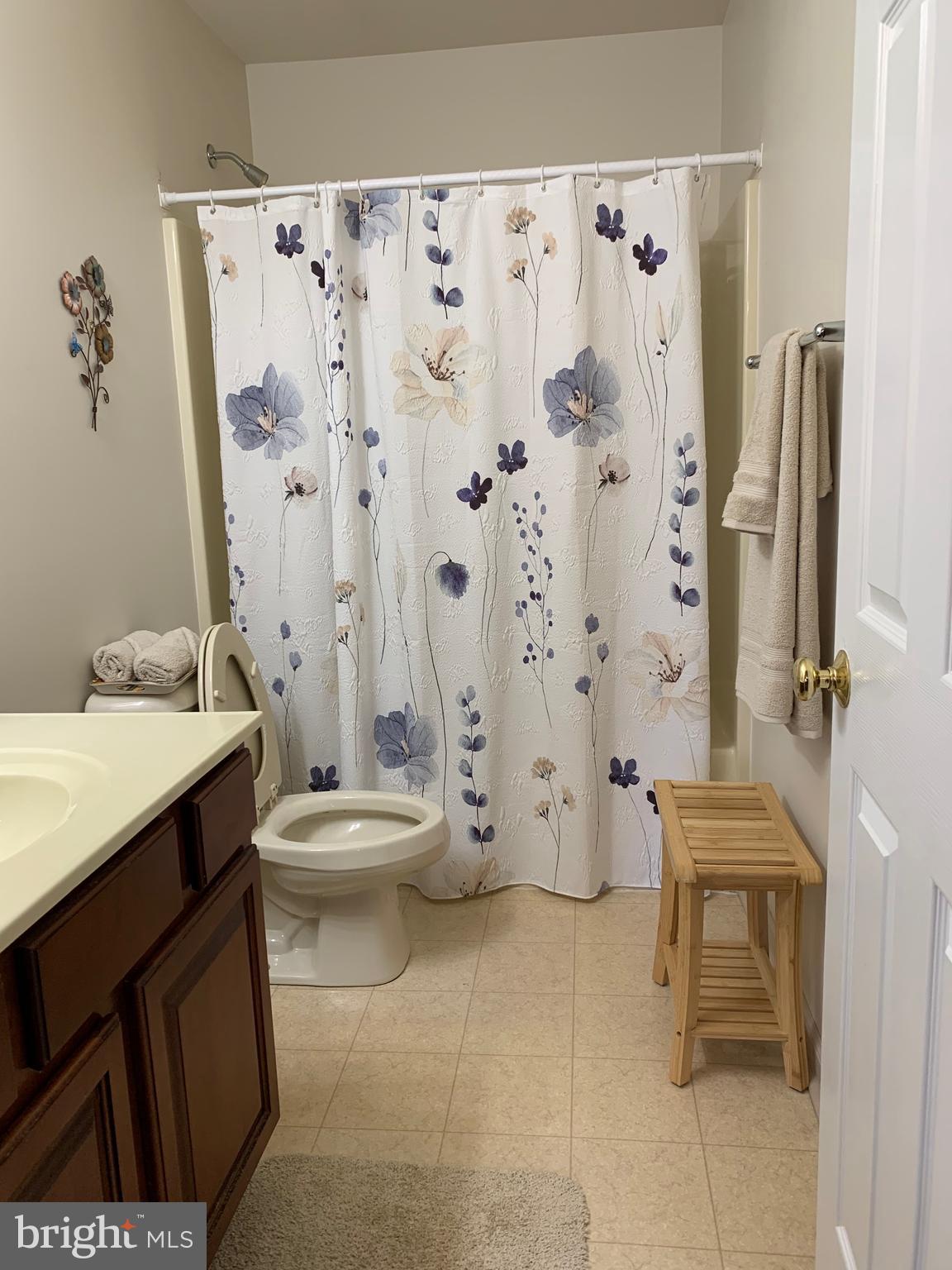 78 Baltusrol Drive Charles Town, WV 25414 - Photo 8 of 26 a bathroom with a granite countertop sink toilet and shower