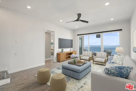 a living room with furniture or couch and a flat screen tv