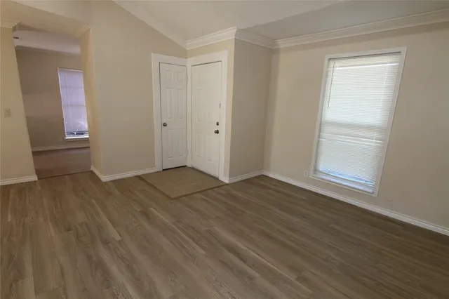 a view of a livingroom with wooden floor