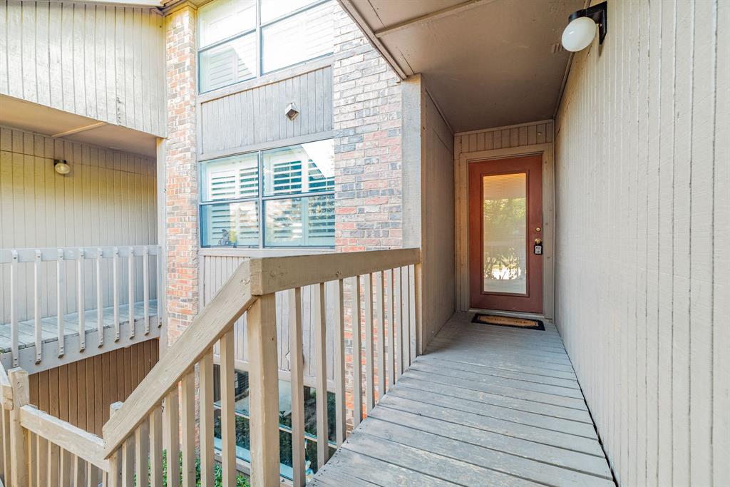 1106 Signal Ridge Place Rockwall, TX 75032 - Photo 1 of 32 a view of a balcony with wooden floor