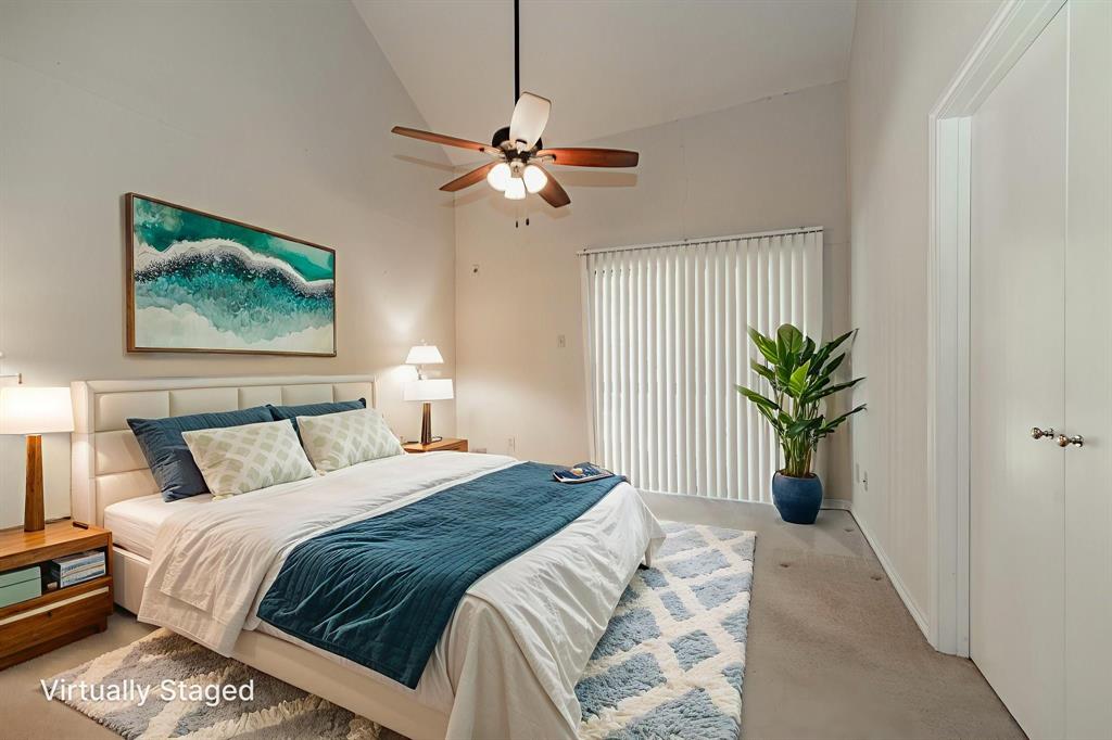 1106 Signal Ridge Place Rockwall, TX 75032 - Photo 19 of 32 a bedroom with a bed and a potted plant