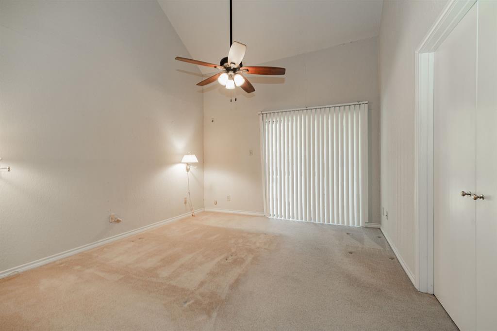 1106 Signal Ridge Place Rockwall, TX 75032 - Photo 20 of 32 en empty room with windows and fan