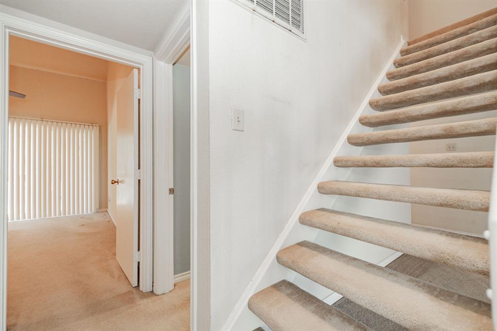 1106 Signal Ridge Place Rockwall, TX 75032 - Photo 24 of 32 Staircase with carpet floors