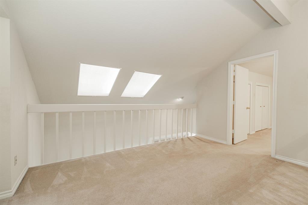1106 Signal Ridge Place Rockwall, TX 75032 - Photo 27 of 32 Bonus room with a skylight and light carpet