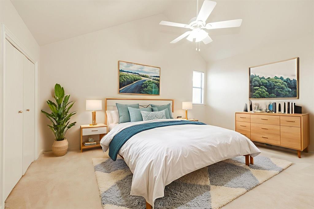1106 Signal Ridge Place Rockwall, TX 75032 - Photo 29 of 32 Bedroom 3-featuring carpet floors, vaulted ceiling, a ceiling fan, and a closet