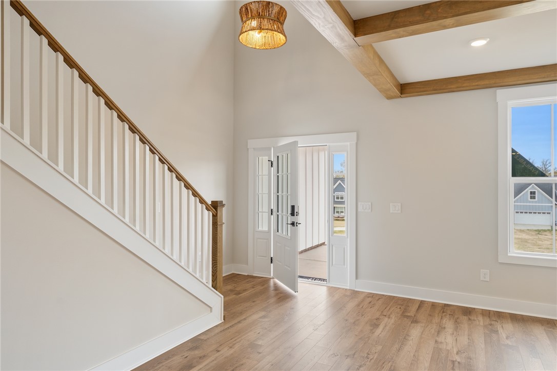 319 Summerall Drive Anderson, SC 29621 - Photo 6 of 37 This inviting entry features durable flooring, an open staircase, and natural light from a large window.