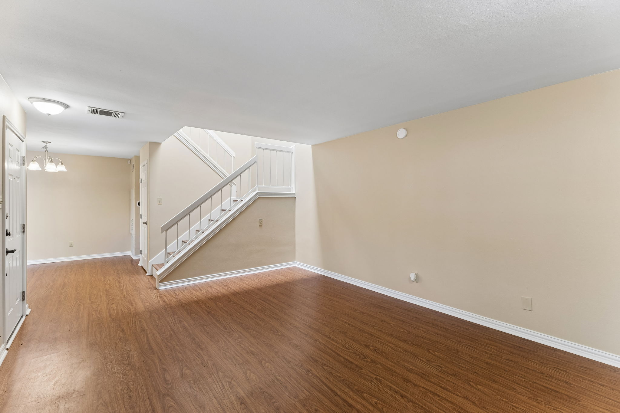 8340 Fathom Circle, Unit 103 Austin, TX 78750 - Photo 9 of 30 a view of an empty room with wooden floor