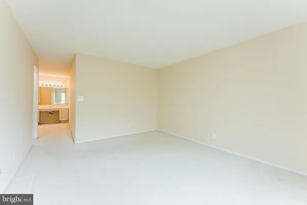 a view of an empty room with windows