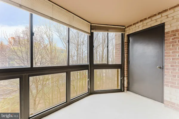 a view of an empty room with a large window