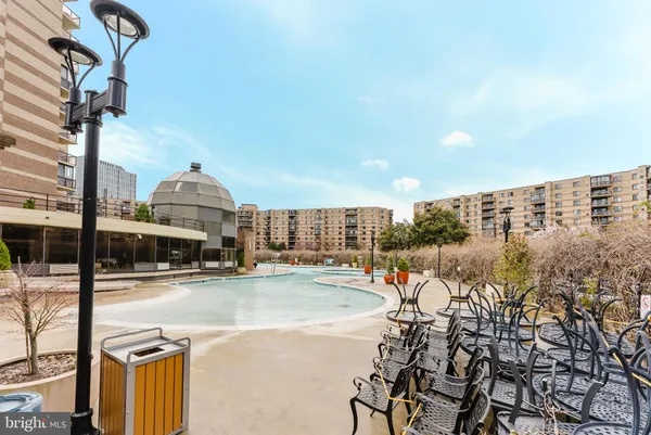a view of a livingroom with furniture and bookshelf
