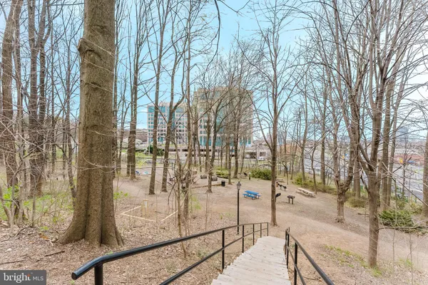 a view of building with outdoor space and garden