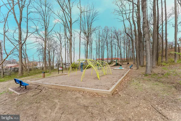 a top view of a house with a yard and fountain in middle