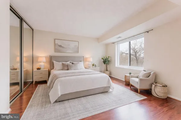 a bedroom with a bed and a couch