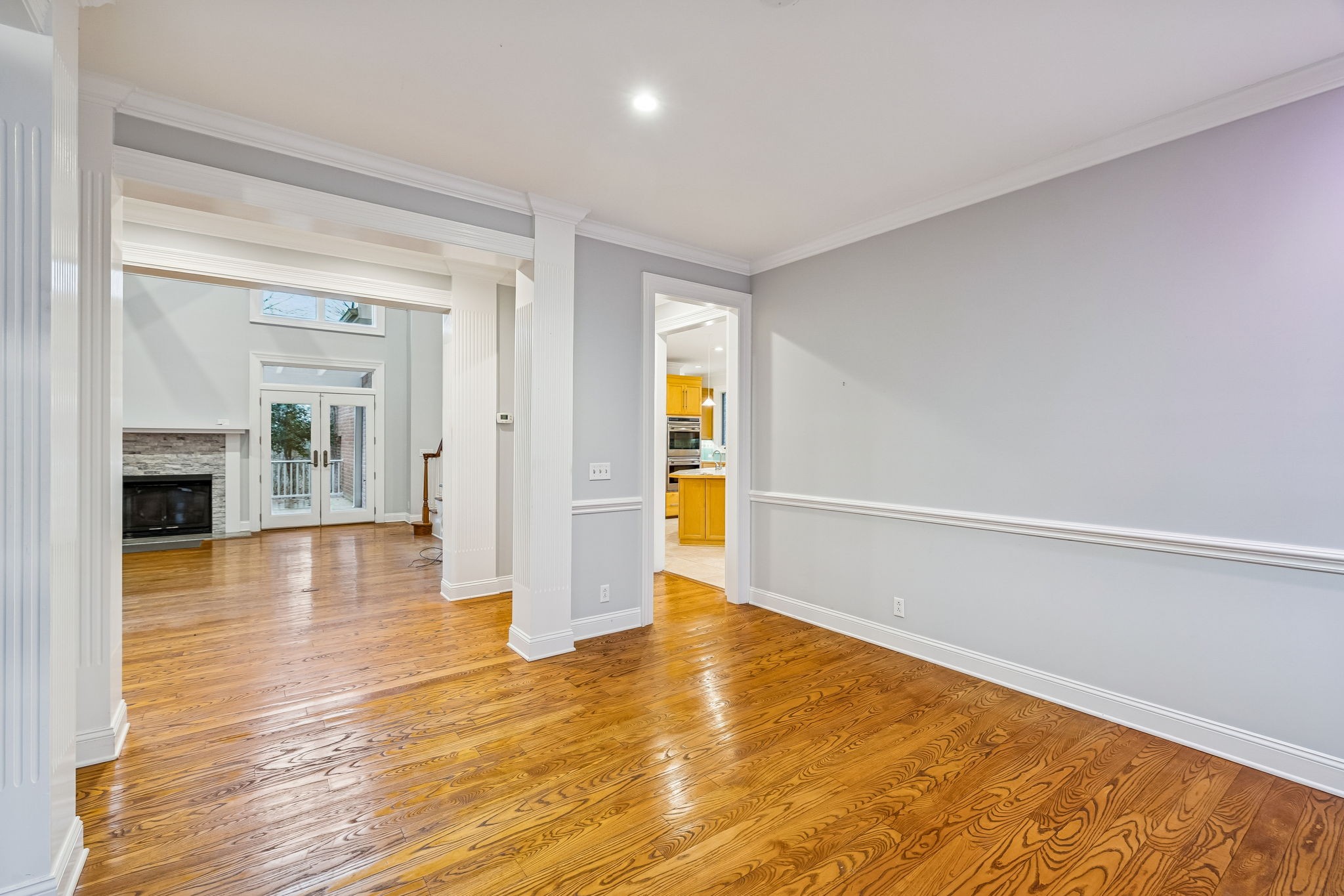 1010 Street Road Kingston Springs, TN 37082 - Photo 11 of 94 a view of an empty room with wooden floor and a window