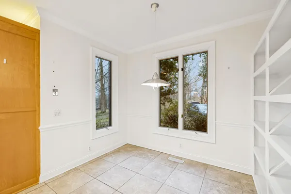 a spacious bathroom with a bathtub and a sink