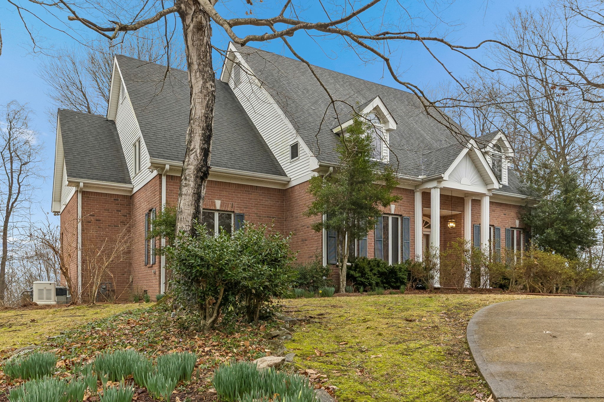 1010 Street Road Kingston Springs, TN 37082 - Photo 2 of 94 a view of a white house next to a yard