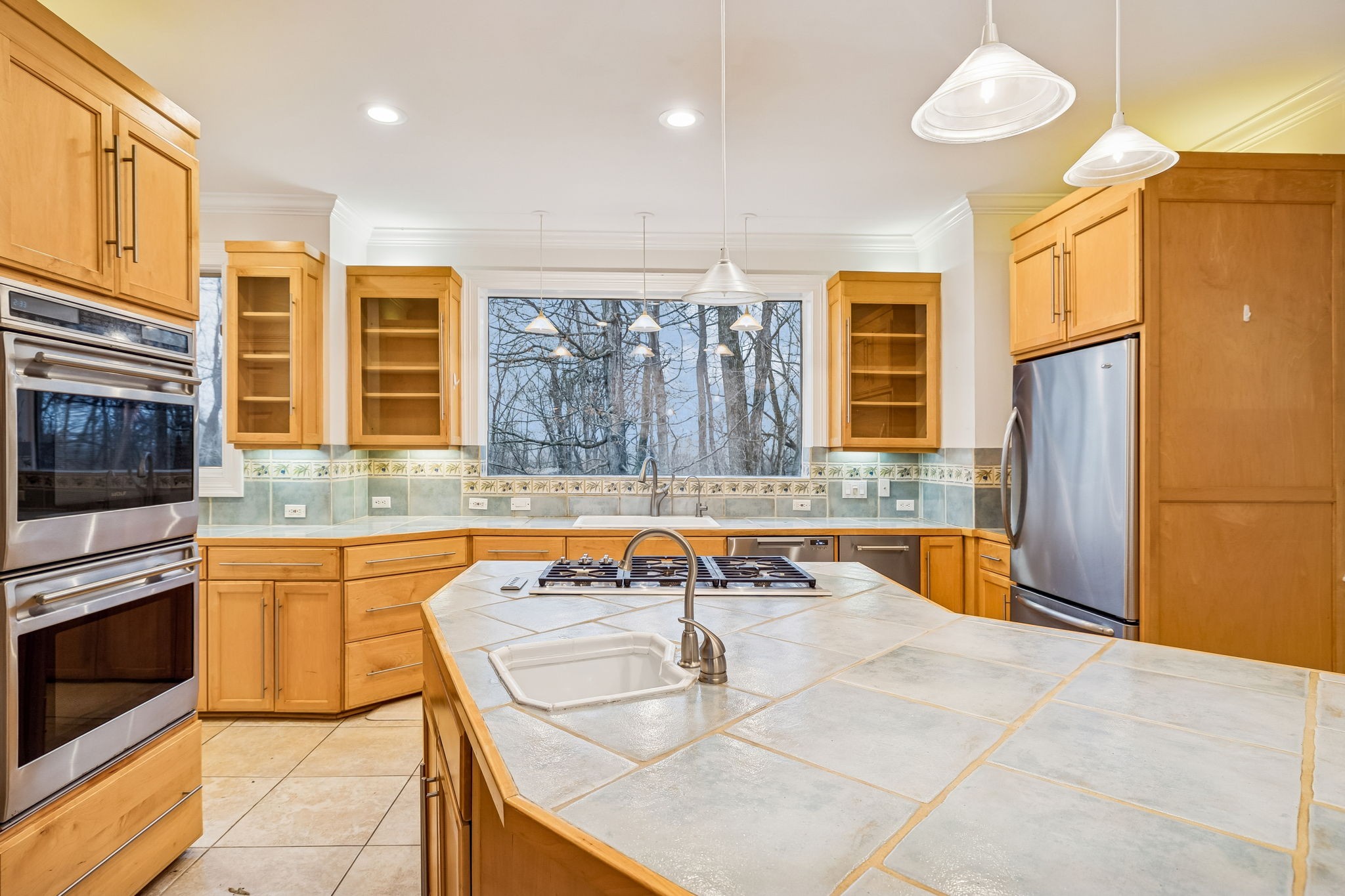 1010 Street Road Kingston Springs, TN 37082 - Photo 25 of 94 a kitchen with stainless steel appliances granite countertop a sink and a refrigerator