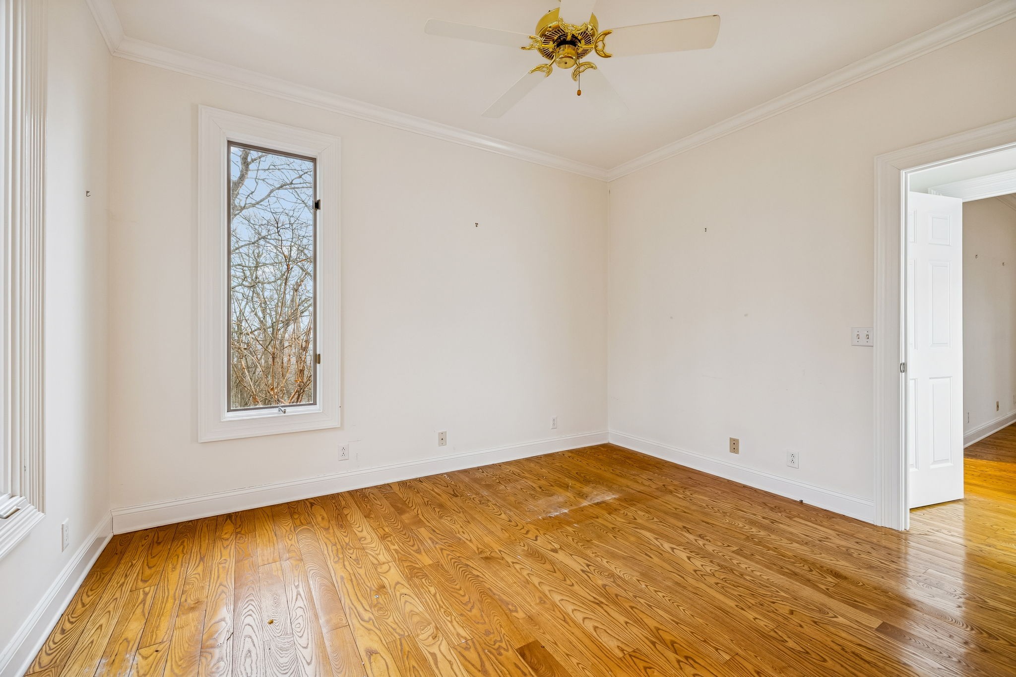 1010 Street Road Kingston Springs, TN 37082 - Photo 27 of 98 a view of an empty room with wooden floor and a window