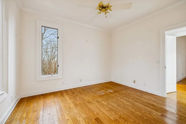 a view of a chandelier fan and entryway