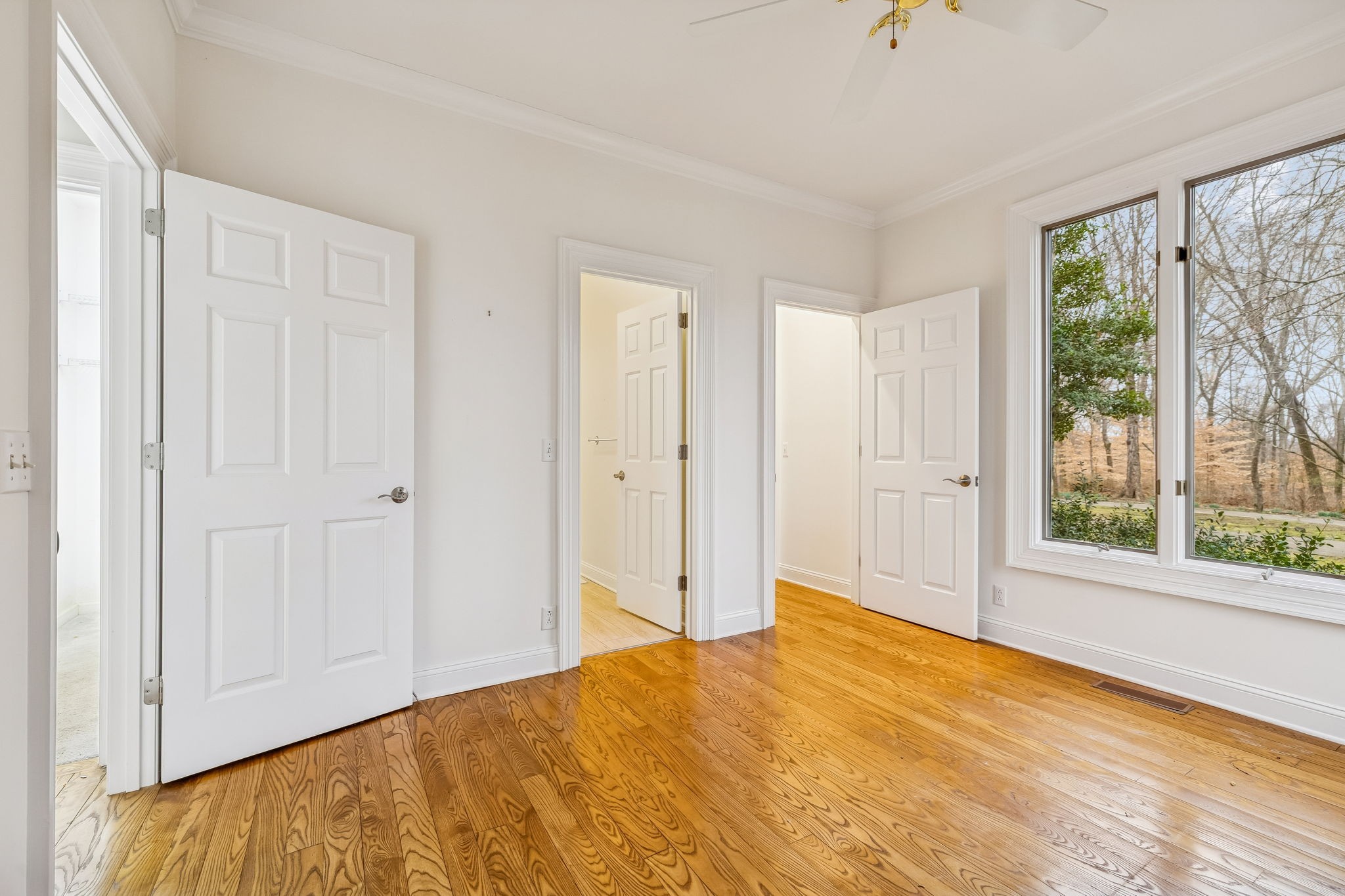 1010 Street Road Kingston Springs, TN 37082 - Photo 28 of 98 a view of an empty room with wooden floor and a window