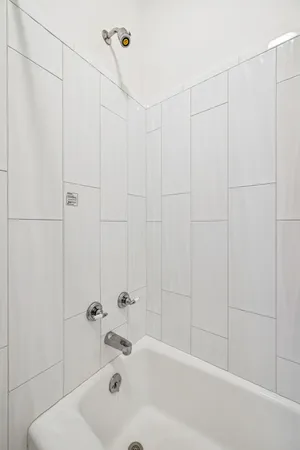 a bathroom with a granite countertop sink