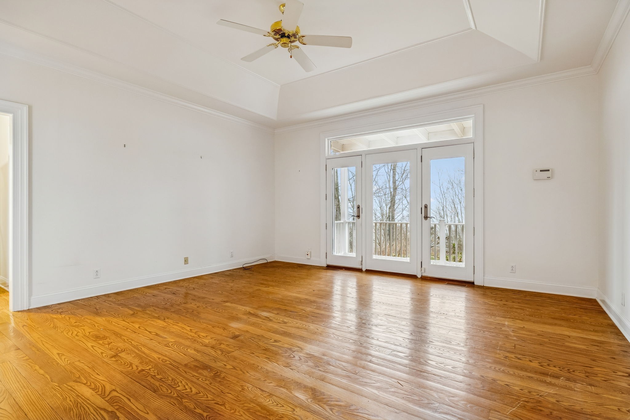 1010 Street Road Kingston Springs, TN 37082 - Photo 34 of 94 a view of an empty room with a window and wooden floor