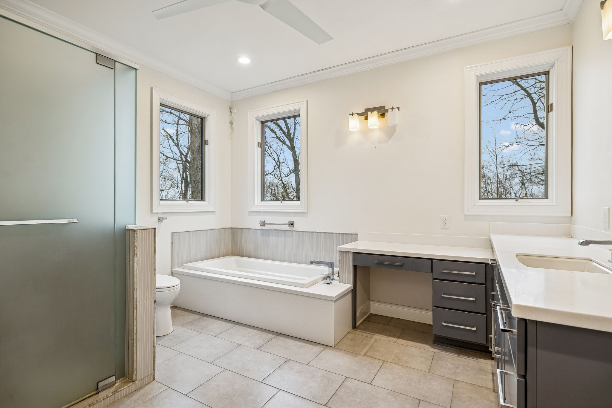 1010 Street Road Kingston Springs, TN 37082 - Photo 38 of 94 a bathroom with a sink a bathtub and a window
