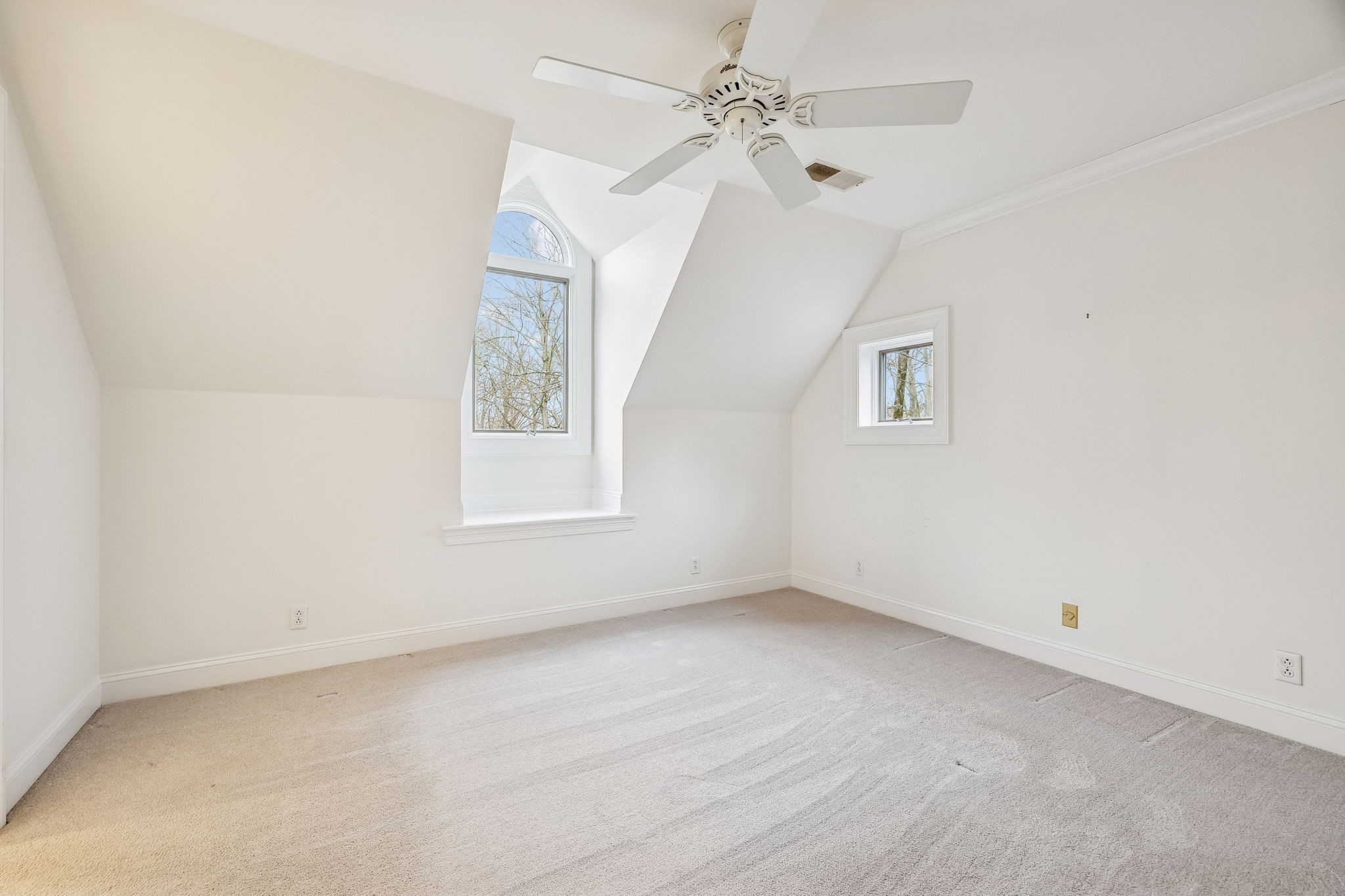 1010 Street Road Kingston Springs, TN 37082 - Photo 61 of 94 an empty room with a window and a ceiling fan