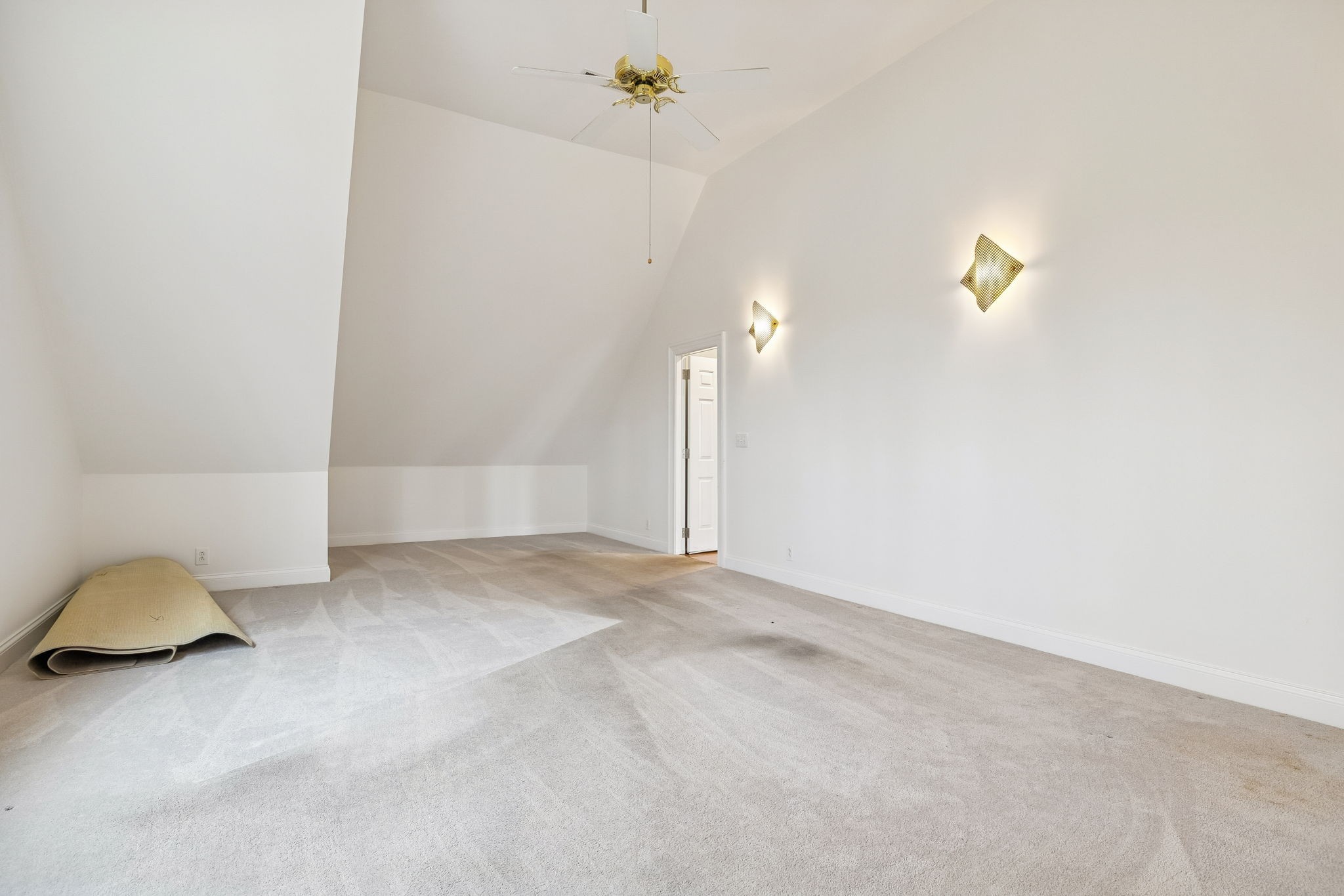 1010 Street Road Kingston Springs, TN 37082 - Photo 75 of 94 a view of a room with gym equipment and a chandelier fan