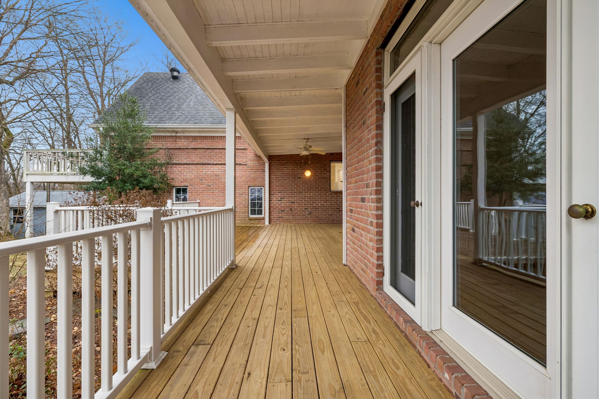 1010 Street Road Kingston Springs, TN 37082 - Photo 80 of 94 a view of a balcony with wooden floor
