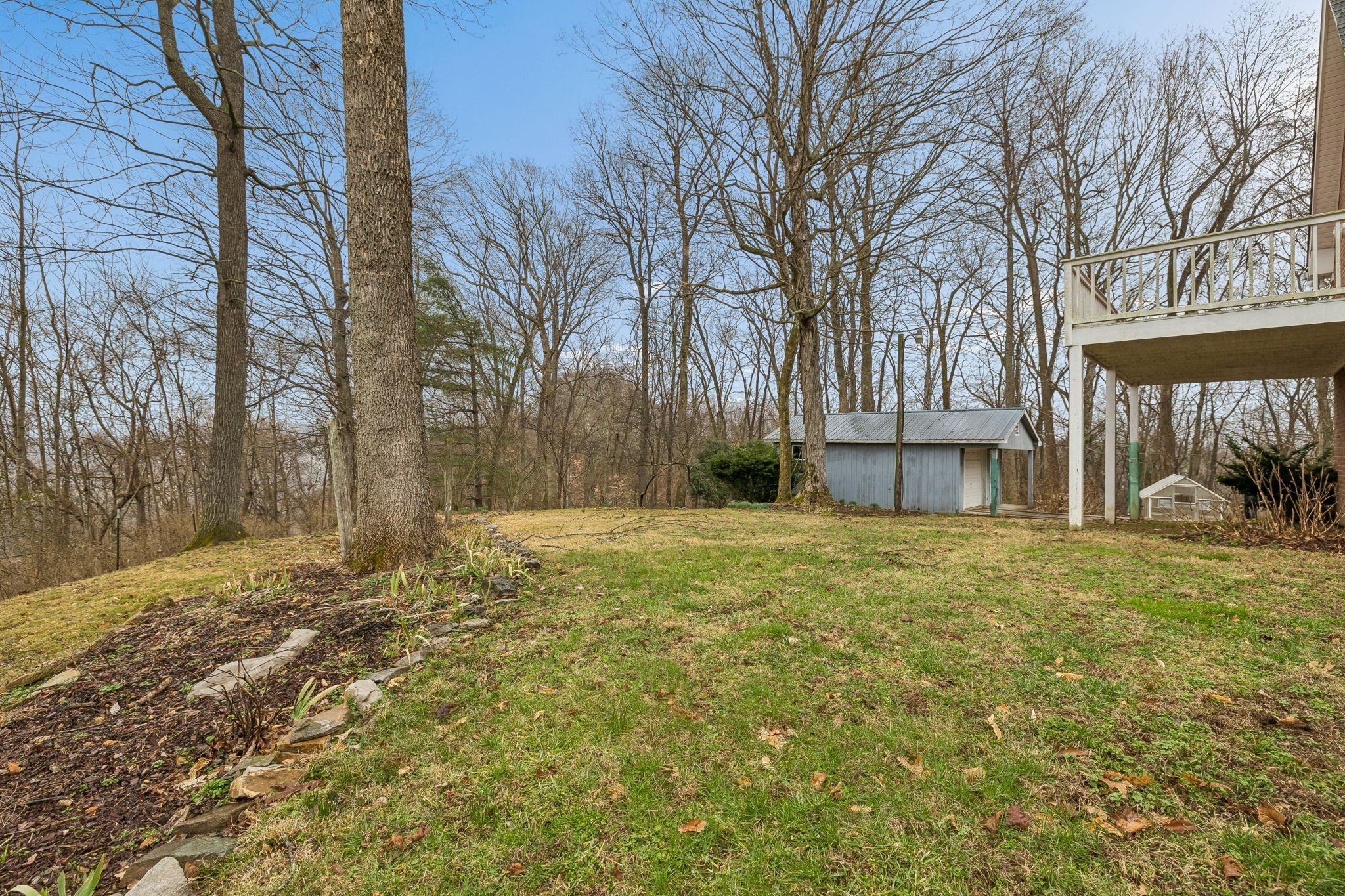1010 Street Road Kingston Springs, TN 37082 - Photo 83 of 94 a yard with trees and a building