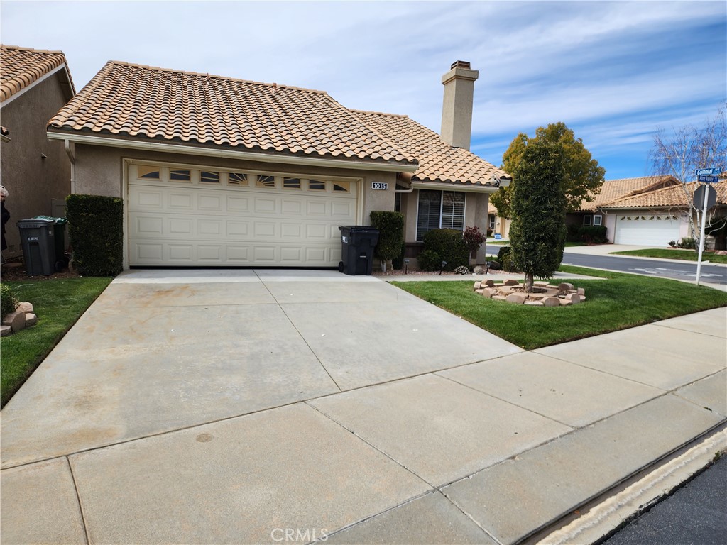 1015 Pine Valley Road Banning, CA 92220 - Photo 1 of 1 a front view of a house with garden