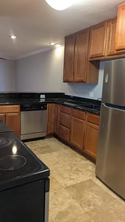 a kitchen with counter top space and cabinets