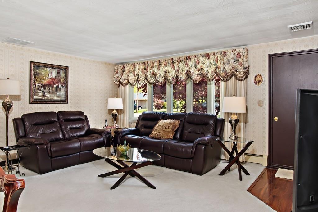 17 Janet Road Chelmsford, MA 01824 - Photo 4 of 28 a living room with furniture and a large window