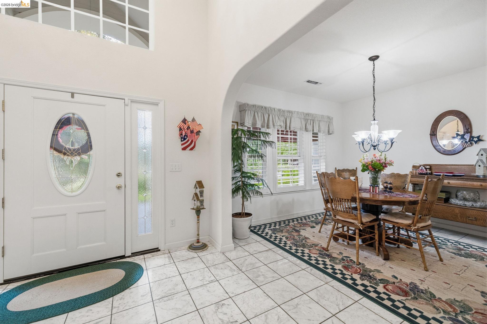 18450 Lambert Lake Road Sonora, CA 95370 - Photo 17 of 87 Foyer entrance with tile flooring and a decorative door featuring an oval leaded glass insert