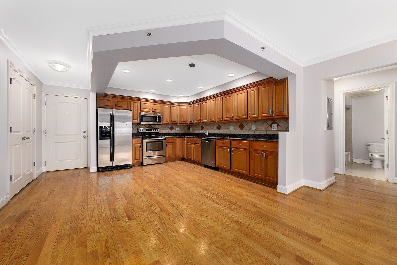 2210 South Goebbert Road, Unit 134 Arlington Heights, IL 60005 - Photo 3 of 10 a view of kitchen with stainless steel appliances granite countertop a refrigerator and a sink