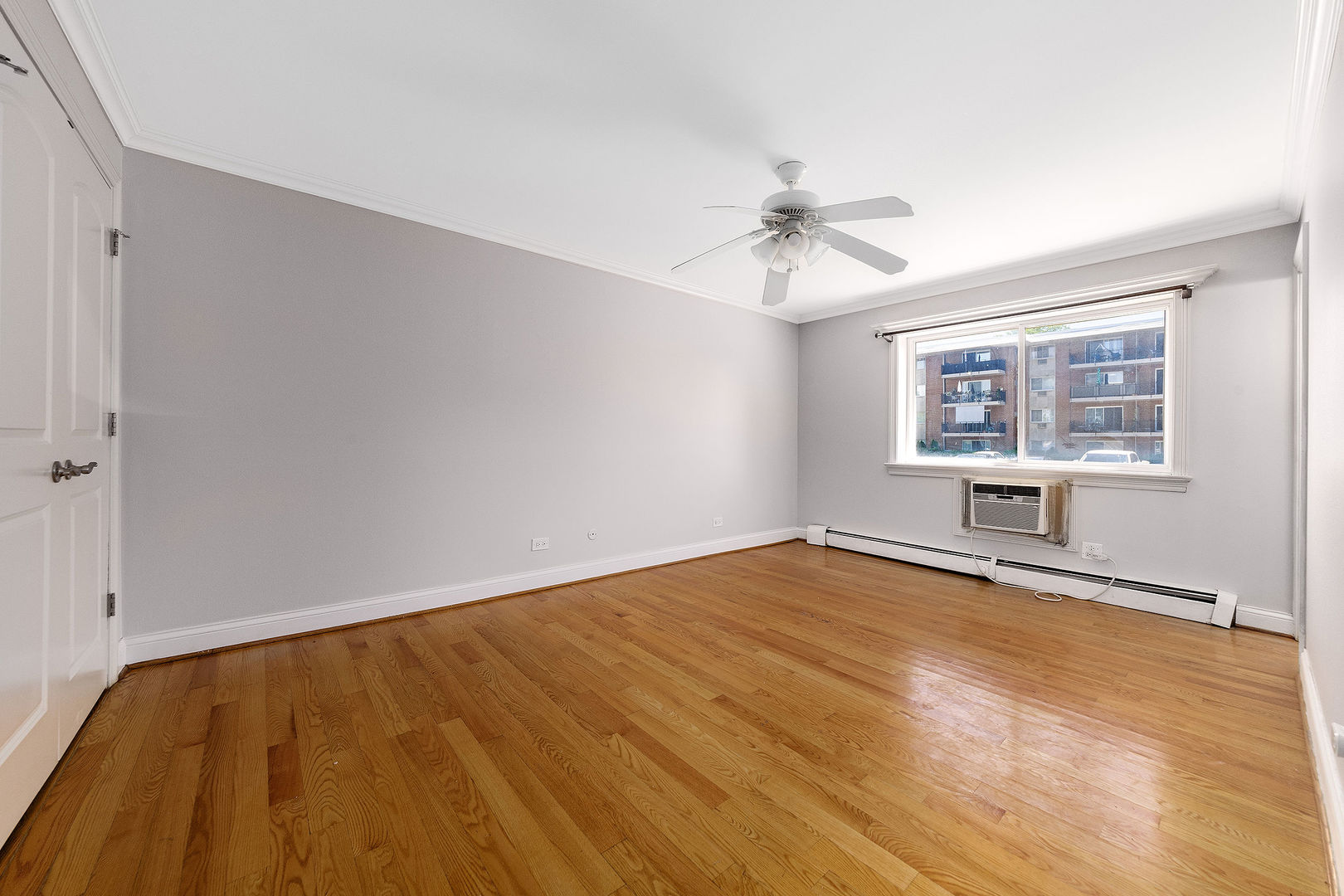 2210 South Goebbert Road, Unit 134 Arlington Heights, IL 60005 - Photo 6 of 10 a view of an empty room with a window