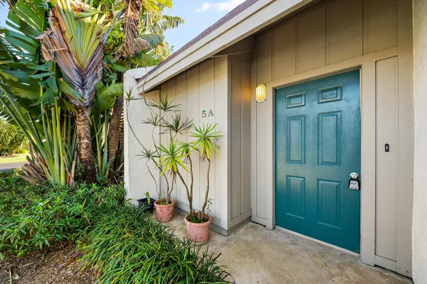 an entrance to house with yard