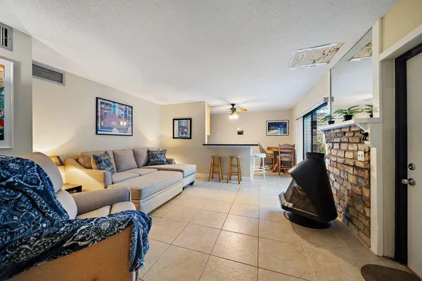 a kitchen with stainless steel appliances granite countertop a sink a stove and a refrigerator