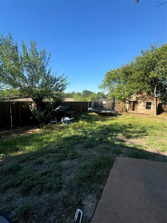 2321 3rd Street Sachse, TX 75048 - Photo 2 of 8 a view of a garden with a building in the background